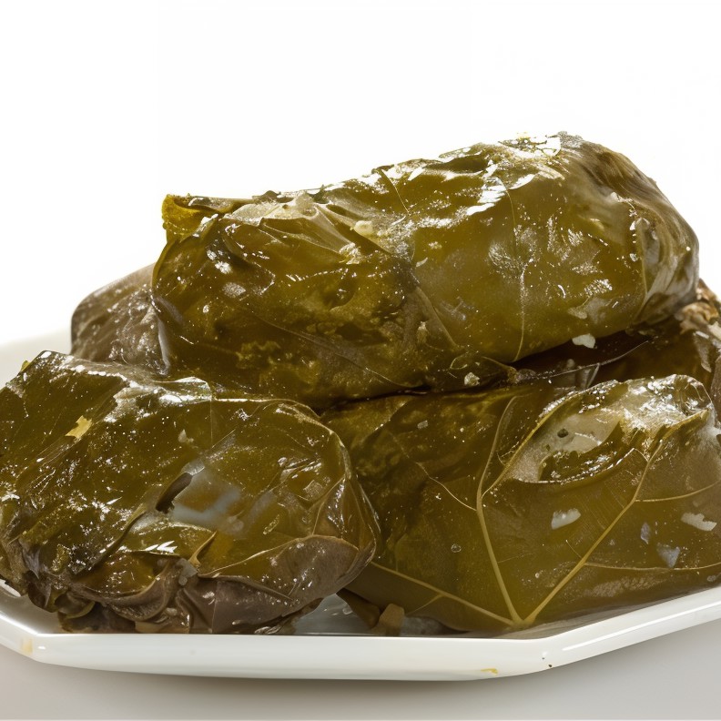 Филе синеглазки в виноградных листьях с лимонно-укропным маслом