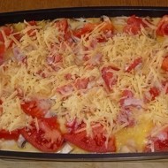 Свинина, запеченная с овощами под соусом бешамель