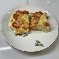 Треска с сыром и помидорами, запеченная в духовке