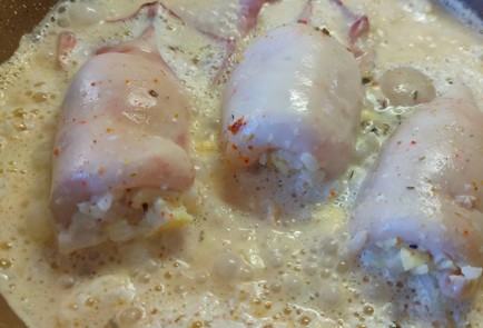 Фото шага рецепта Кальмары фаршированные рисом с яйцом 190229 шаг 21  