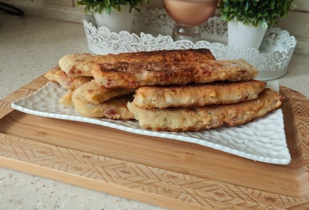 Фото шага рецепта Палочки с ветчиной и сыром на сковороде 189083 шаг 13  