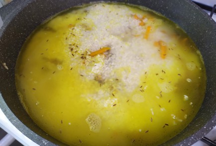 Фото шага рецепта Плов с курицей 190145 шаг 9  